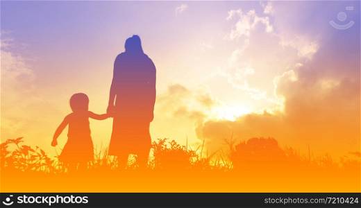 silhouettes of a women with her kid during sunset