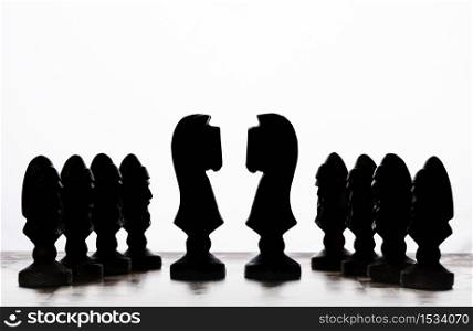 silhouettes of chess pieces on a white background