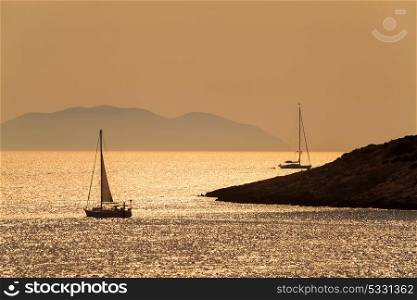 Silhouettes of yacts or boats sailing at sunset, Hvar, Croatia, Europe