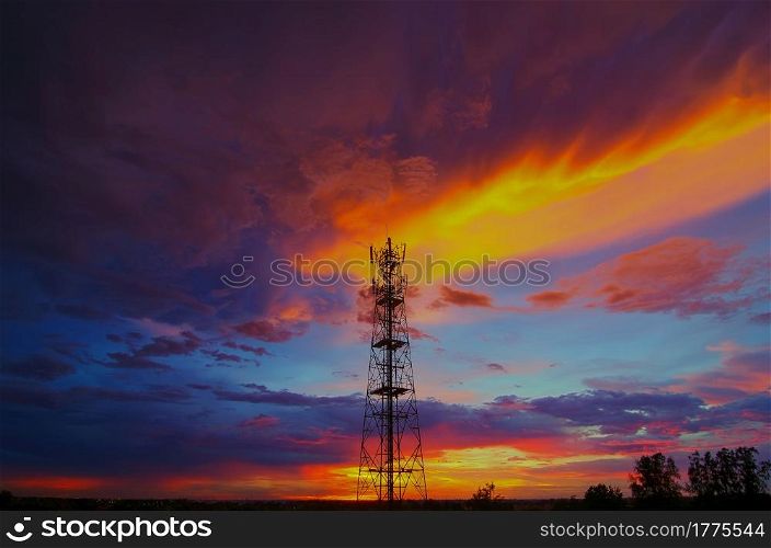 Silhouettes telecommunication tower at sunset. Beautiful sky.. Silhouettes Telecommunication tower