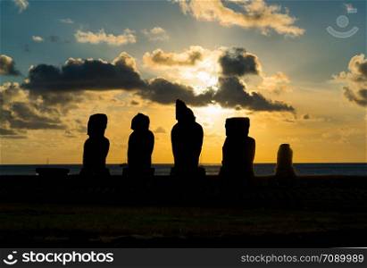 Silhuette of Ahu Vai Uri in the archaeological site of Tahai on Easter Island at sunset