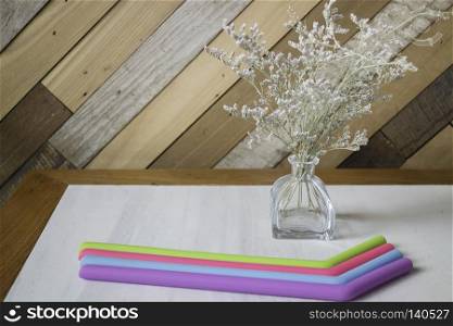 Silicone drinking straw on table, stock photo