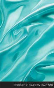 Silk or Satin luxury cloth fabric texture Smooth elegant wavy turquoise , abstract background design