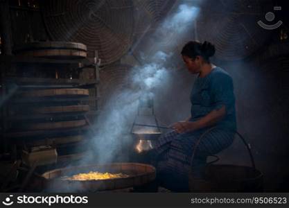 Silkworms are spun into threads by village women. the silk thread is wound into the tube using the Ni machine as a tool.
