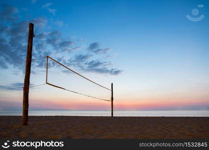 Sillhouette of beach volleyball net with sky sunset on the beach