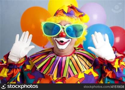 Silly clown in oversized glasses, making a surprised face.
