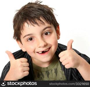 Silly seven year old boy making crossed eyes and thumbs up gesture.