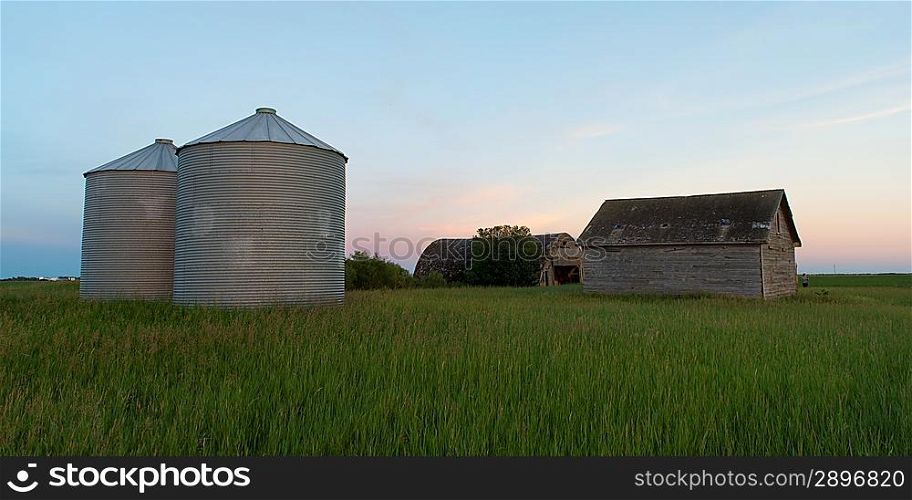 Silo and barn in a prairie field, Manitoba, Canada