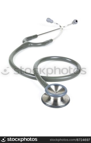 Silver and blue stethoscope on white background