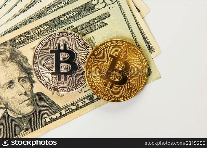 Silver and gold bitcoin coins with dollars on the white background. Bitcoin coin with dollars