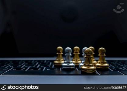 Silver and Gold chess on laptop, Marketing or business strategy, Chess battle victory success, Team leader teamwork business strategy, Chess business concept, Leader and success concept.