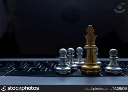 Silver and Gold chess on laptop, Marketing or business strategy, Chess battle victory success, Team leader teamwork business strategy, Chess business concept, Leader and success concept.