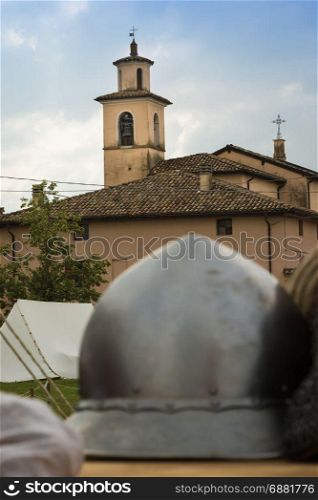 Silver and Metallic Knight Helmet on Wooden Table, Medieval Theme