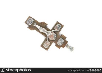 silver and wooden cross with religious inscriptions isolated on a white