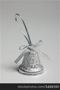 Silver bell Christmas on a gray background
