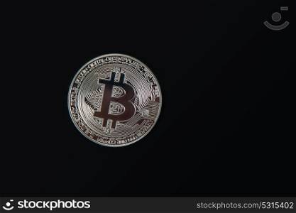 Silver Bitcoin coin. Silver Bitcoin coin on the black background