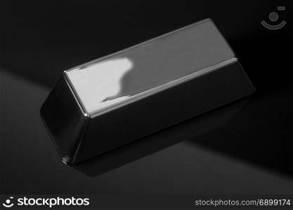 Silver bullion on black background