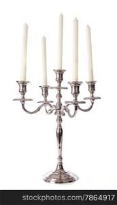 silver candelabrum in front of white background