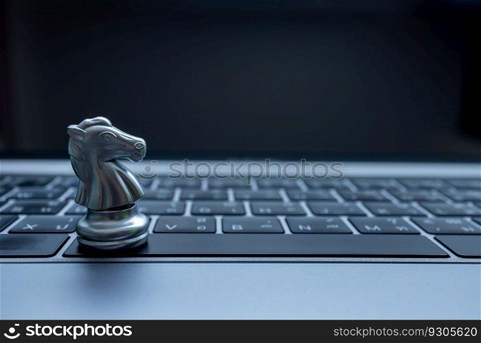 Silver chess on laptop, Marketing or business strategy, Chess battle victory success, Team leader teamwork business strategy, Chess business concept, Leader and success concept.