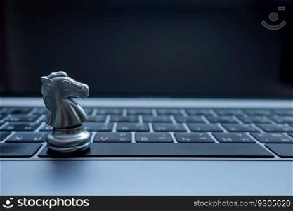 Silver chess on laptop, Marketing or business strategy, Chess battle victory success, Team leader teamwork business strategy, Chess business concept, Leader and success concept.