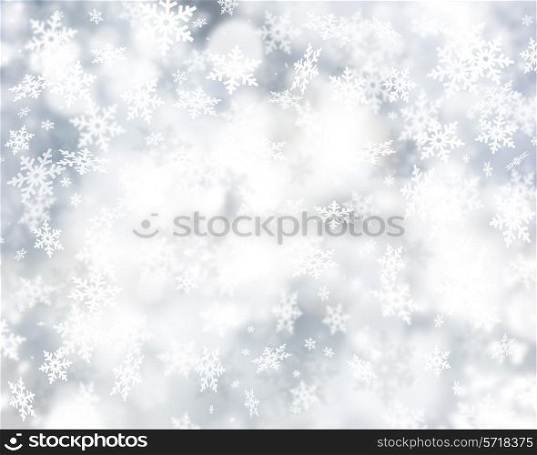 Silver Christmas background of falling snowflakes