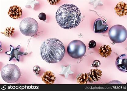 Silver Christmas decorations with gift box on pink background. Gray Christmas decorations on pink