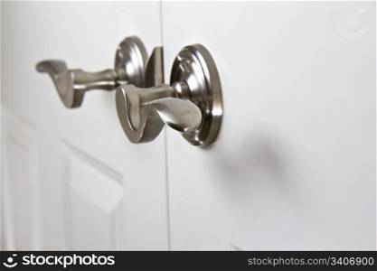 Silver- Chrome curved interior door handles on white door