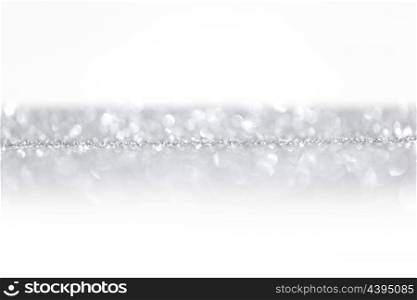 Silver glitter background with white copy space