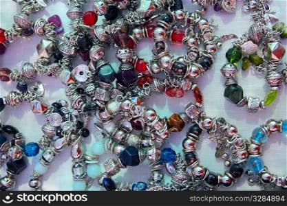 silver jewellery blacelets shop display colorful stones