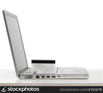 silver laptop cut out from white background