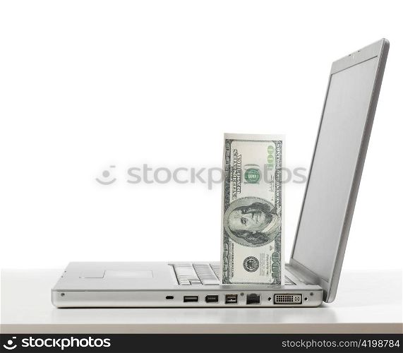 silver laptop cut out from white background
