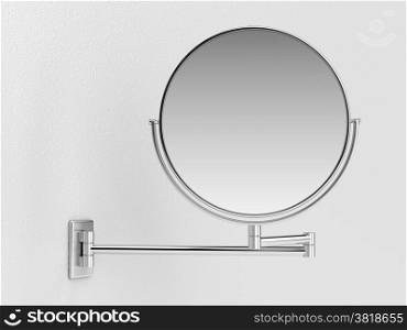 Silver makeup mirror on white wall