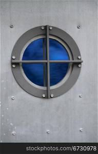 Silver metal door with porthole window with view on sea