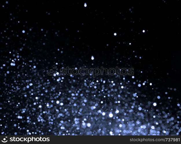 Silver overlay background of glittering lights with bokeh effect.