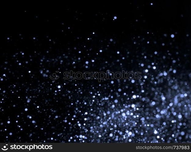 Silver overlay background of glittering lights with bokeh effect.