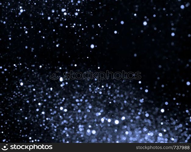 Silver overlay background of glittering lights with bokeh effect.