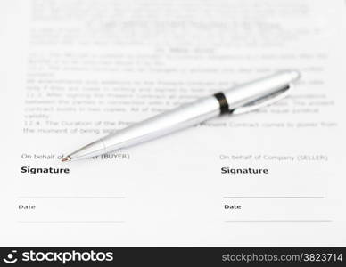 silver pen on signature page of sales contract