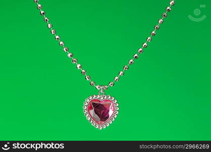 Silver pendant isolated on the colourful background