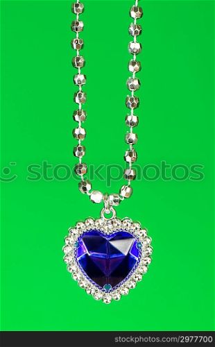 Silver pendant isolated on the colourful background