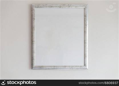 silver picture frame decorating on white wall