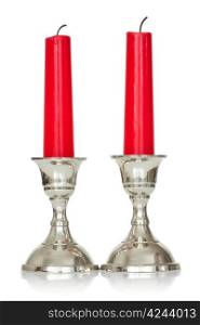 silver plated candlesticks with red candles on white background