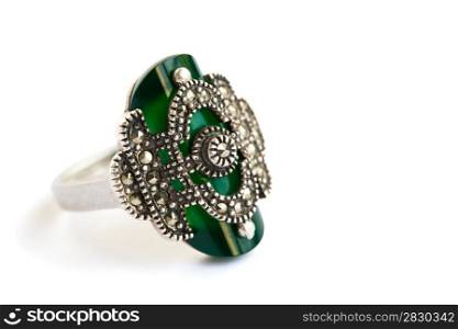 Silver ring with green stone isolated on white background.
