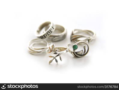 Silver rings on white background