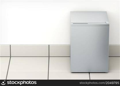 Silver small refrigerator in the kitchen