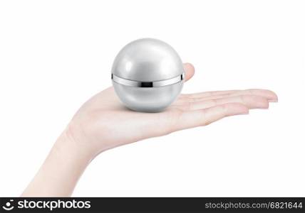 Silver sphere cosmetic jar on hand isolated