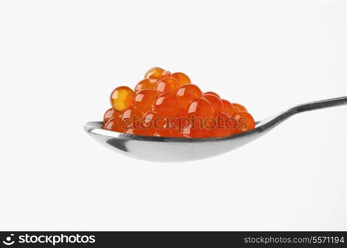 Silver spoon full of trout caviar