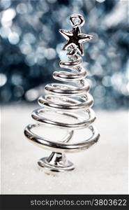 Silver stylized Christmas tree with lights background