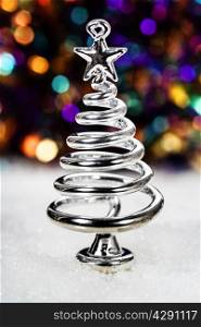 Silver stylized Christmas tree with lights background