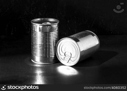 silver tall round tin cans