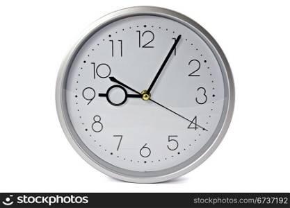 silver wall clock over a white background
